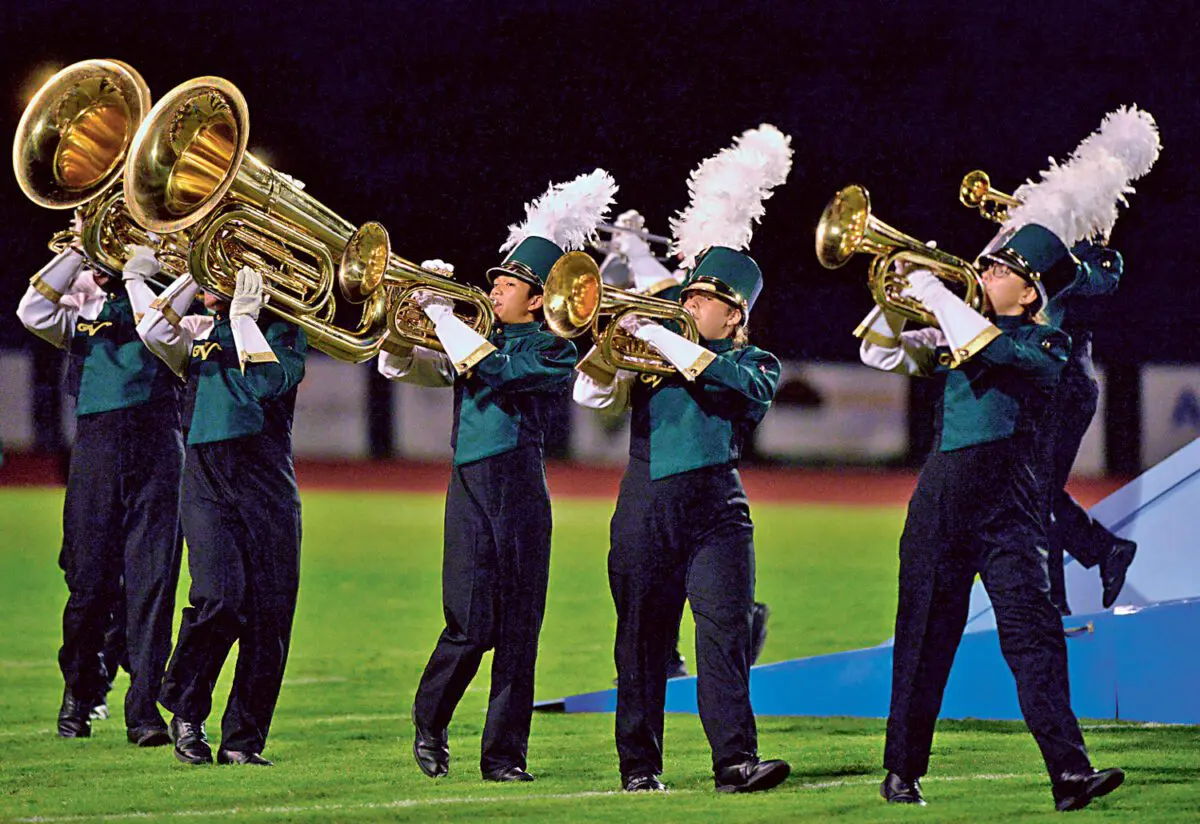 George Horsford / Daily Sun - The members of The Villages High School Marching Buffalo Band play their instruments as they march across the football field during their halftime performance of "Above the Clouds" during the football game against Interlachen on October 13, 2017.